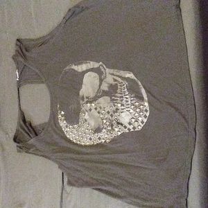 Torrid black open back tank with metallic skull and studs.